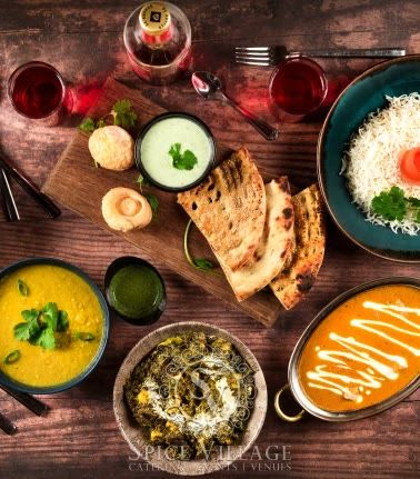 A Lahori breakfast spread of curries, breads and chutneys.