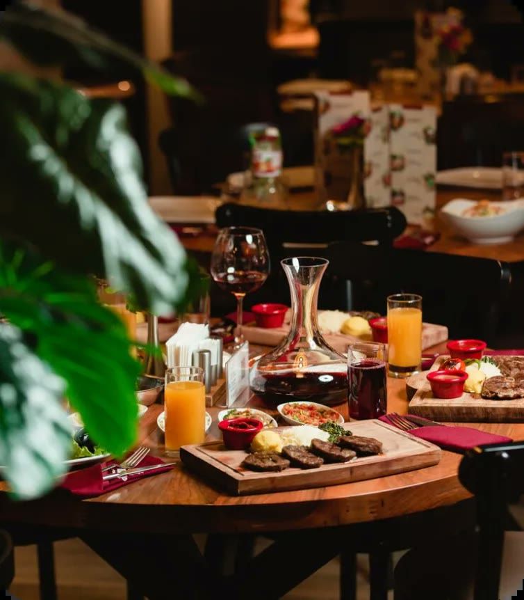 A laid table with grill boards, glassware and sharing plates at a Spice Village event.