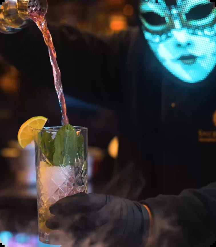 A signature mocktail being poured at the bar.